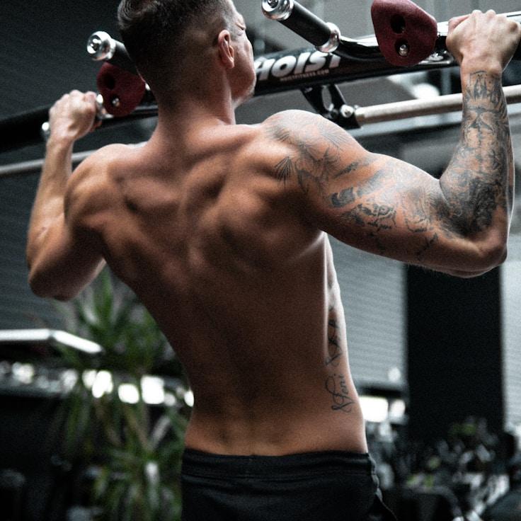 Interior of a professional gym with weight training equipment and mirrors